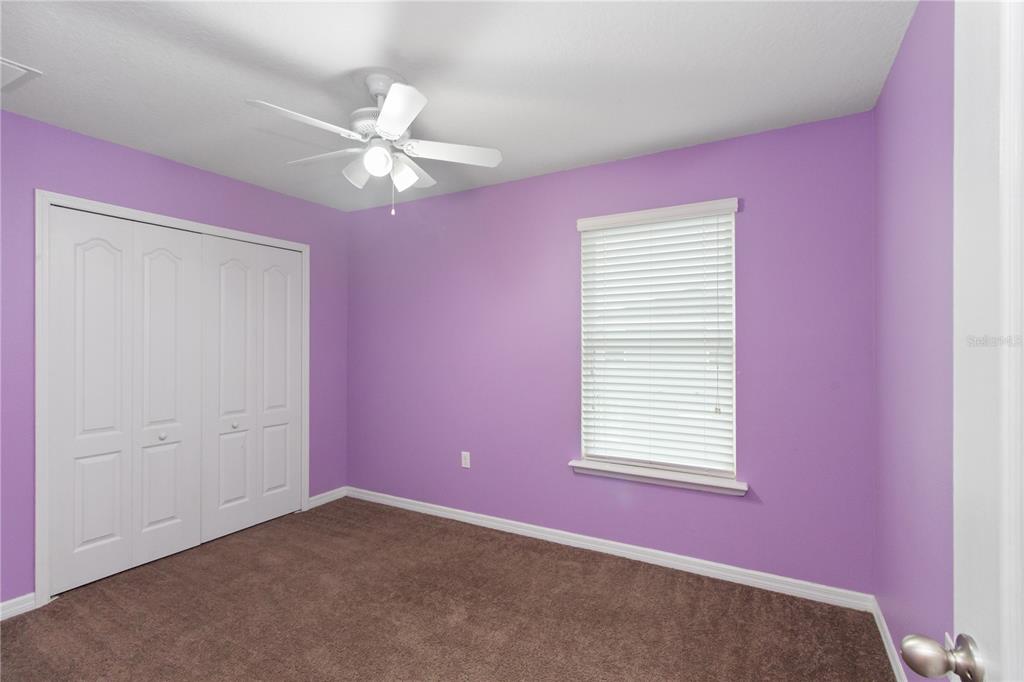 13222 Weatherstone Drive Spring Hill, FL 34609 - Photo 12 of 46 an empty room with a window and a ceiling fan