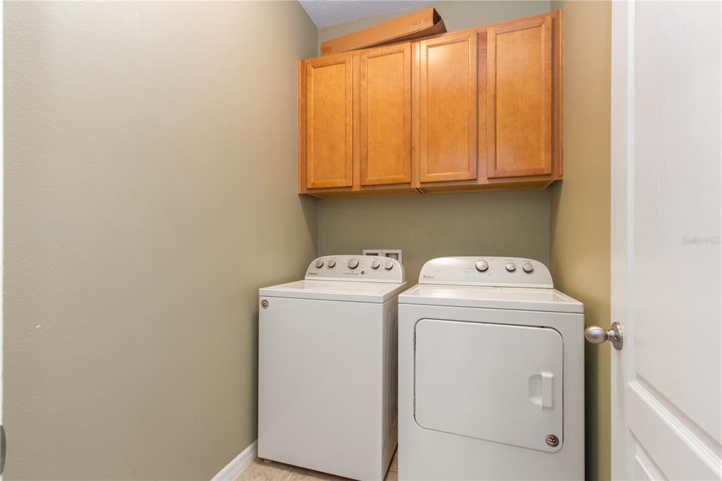 13222 Weatherstone Drive Spring Hill, FL 34609 - Photo 24 of 46 a utility room with dryer and washer