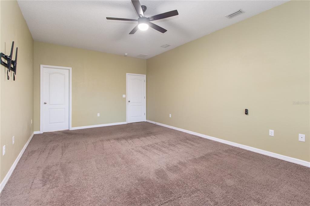 13222 Weatherstone Drive Spring Hill, FL 34609 - Photo 27 of 46 a view of an empty room with a window