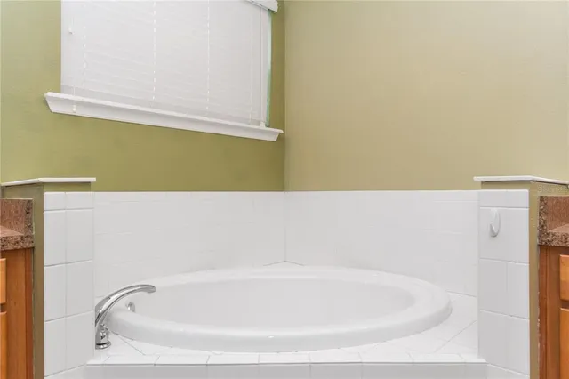 a bathroom with a shower sink and mirror