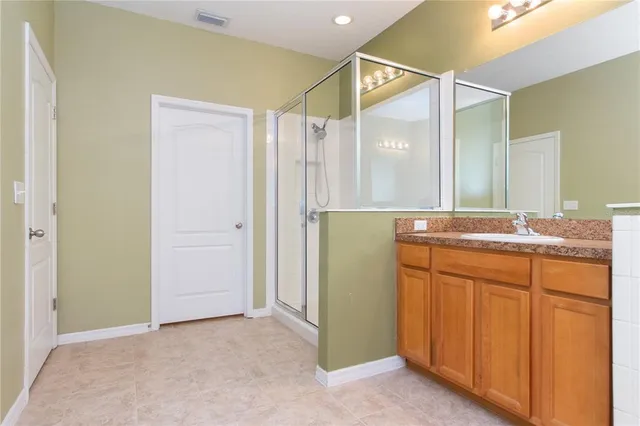 a white toilet sitting next to a white wall