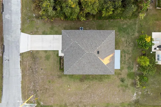 an aerial view of a house with a outdoor space