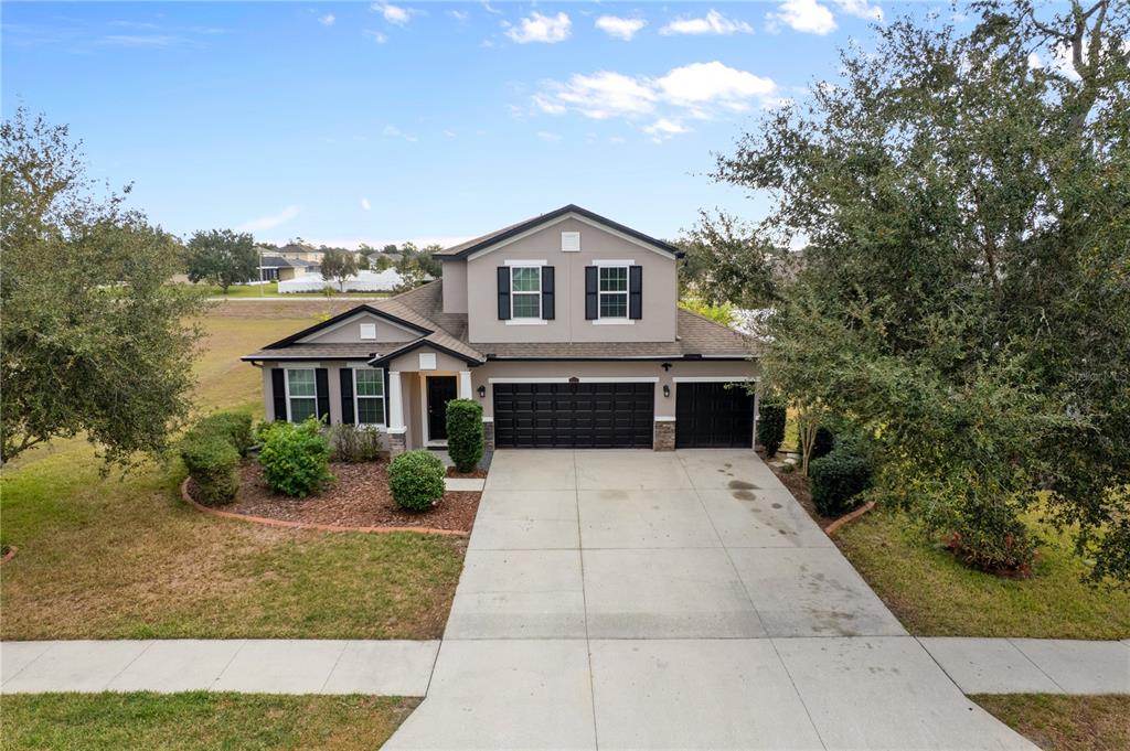 13222 Weatherstone Drive Spring Hill, FL 34609 - Photo 41 of 46 a front view of a house with a yard
