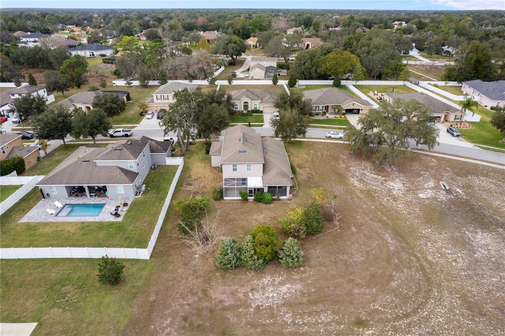 13222 Weatherstone Drive Spring Hill, FL 34609 - Photo 44 of 46 an aerial view of residential houses with outdoor space and parking