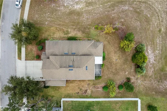 an aerial view of a house with a garden