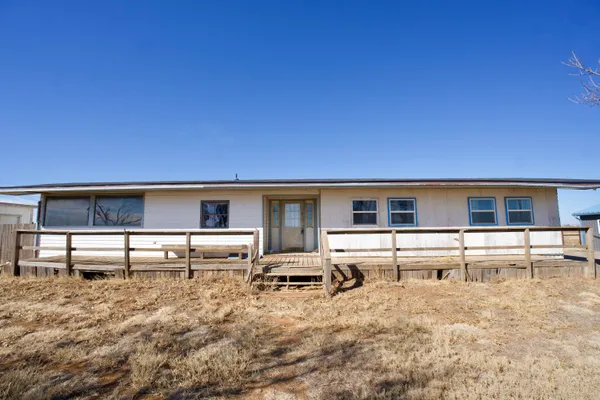 a kitchen with stainless steel appliances kitchen island granite countertop a stove top oven a sink and a granite counter top