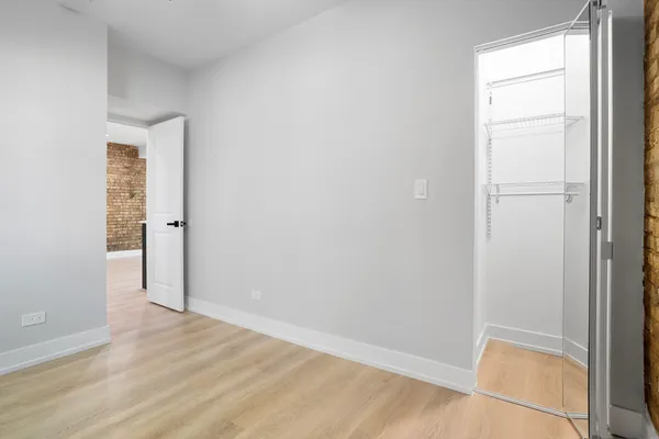 an empty room with wooden floor