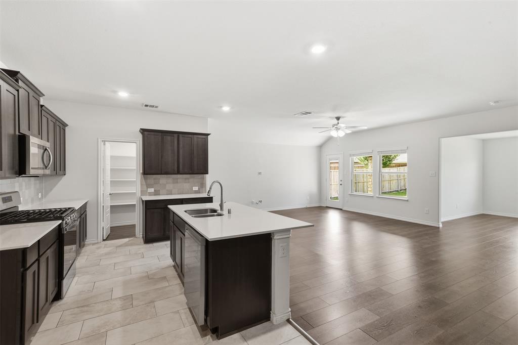 415 Boston Road Fate, TX 75189 - Photo 9 of 40 Kitchen towards living