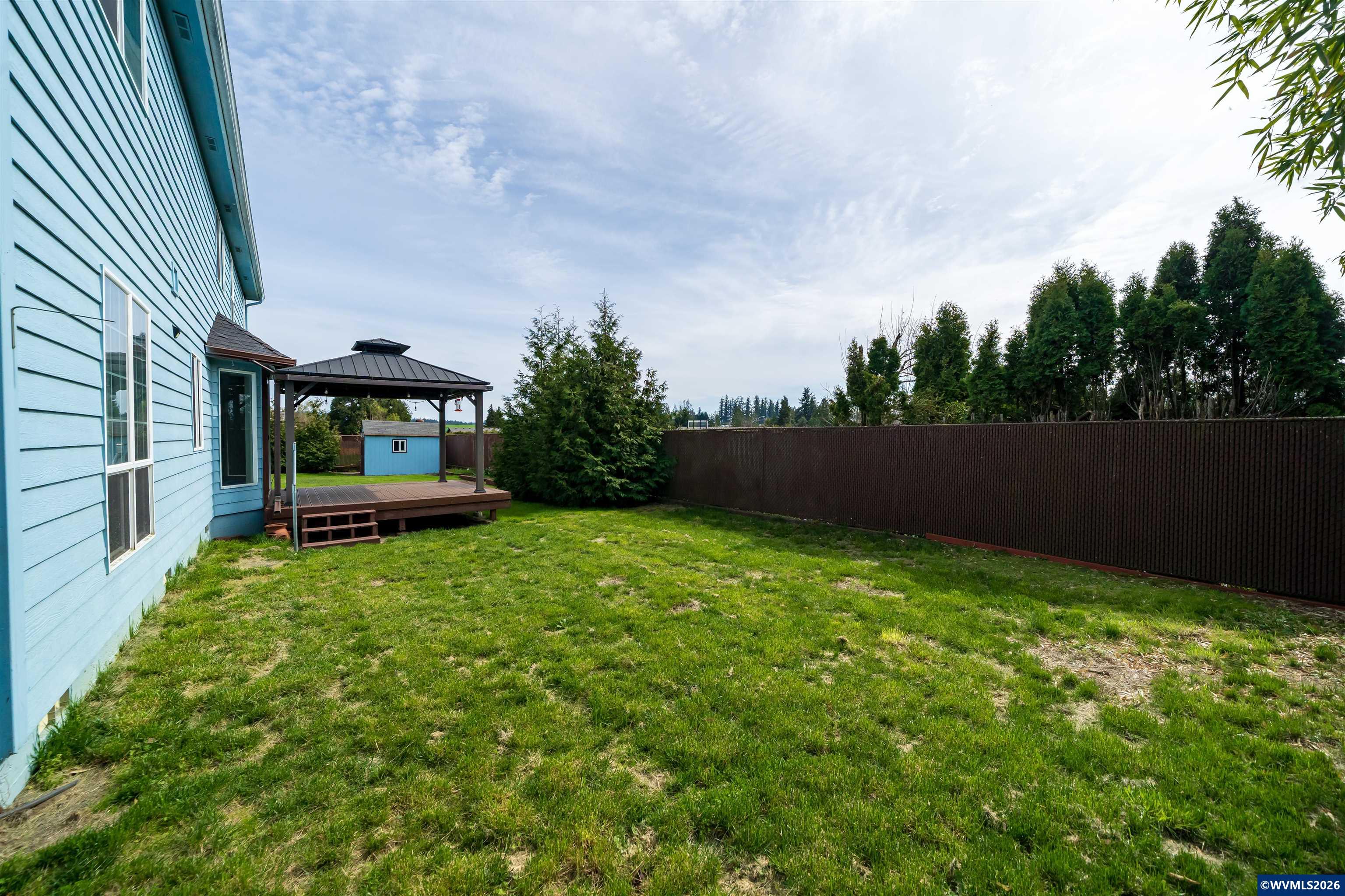 312 Southwest Cascade Meadow Drive Sublimity, OR 97385 - Photo 39 of 42 a backyard of a house with lots of green space