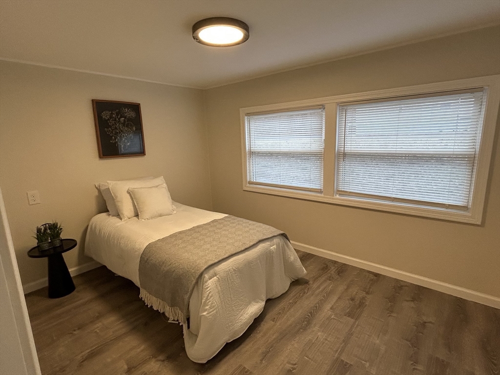 229 Miller Street, Unit D6 Ludlow, MA 01056 - Photo 13 of 24 a bedroom with a bed and a window