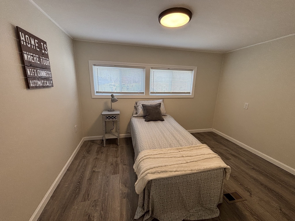 229 Miller Street, Unit D6 Ludlow, MA 01056 - Photo 14 of 24 a bedroom with a bed and window