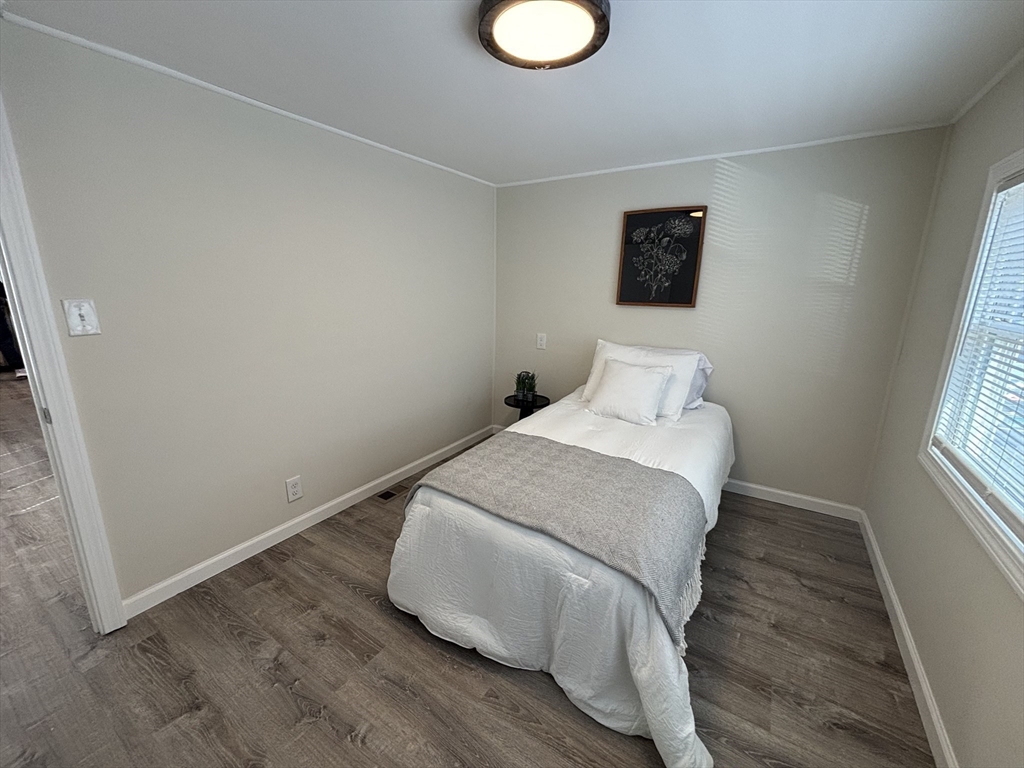 229 Miller Street, Unit D6 Ludlow, MA 01056 - Photo 16 of 24 a bedroom with a bed and a window