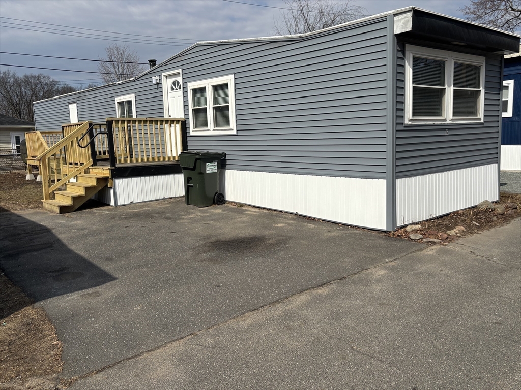229 Miller Street, Unit D6 Ludlow, MA 01056 - Photo 17 of 24 a view of garage and deck