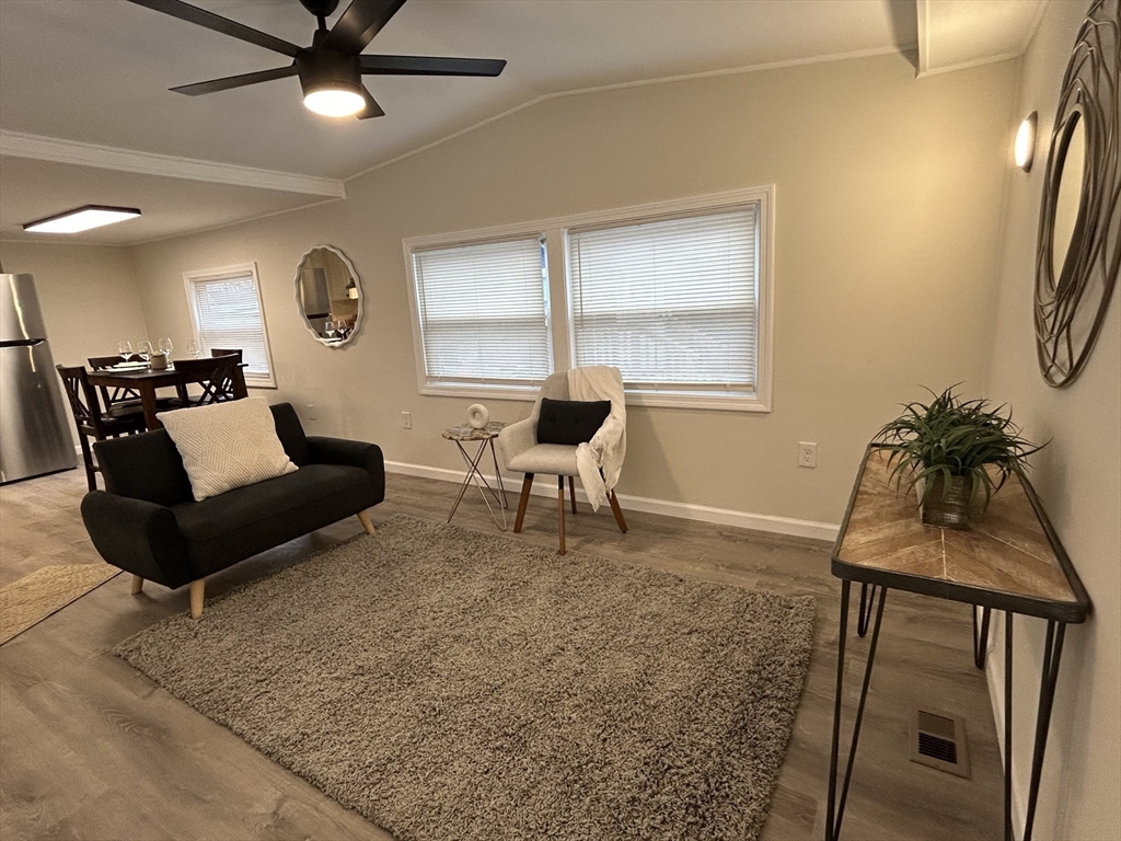 229 Miller Street, Unit D6 Ludlow, MA 01056 - Photo 6 of 24 a living room with furniture and a window