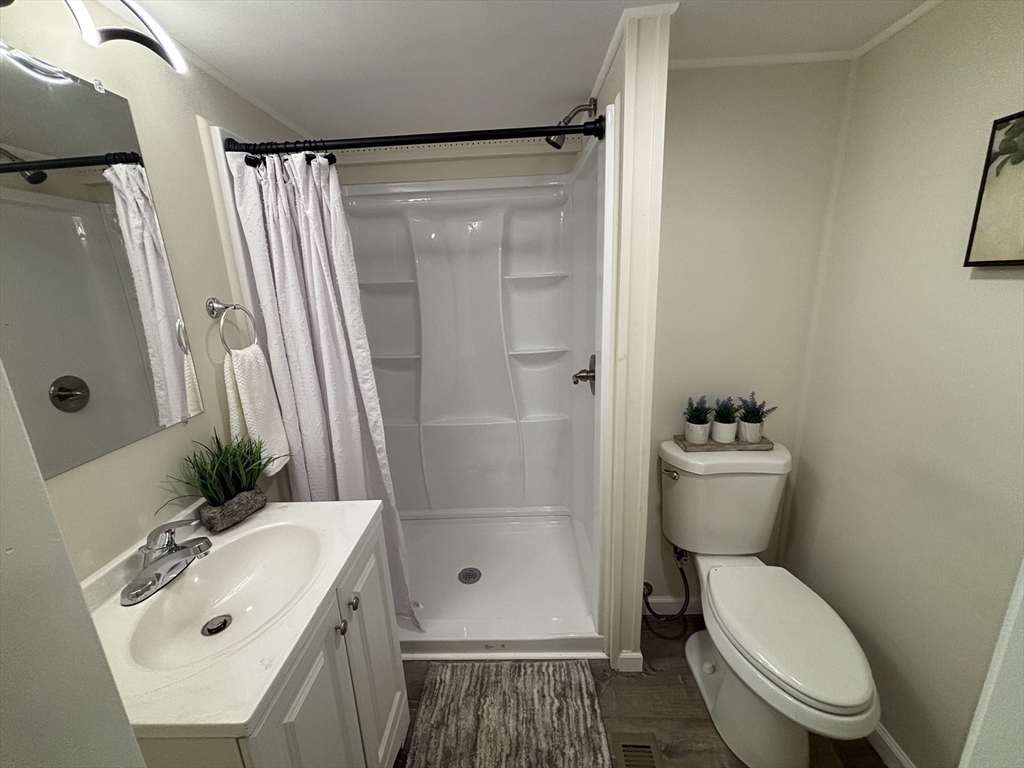 229 Miller Street, Unit D6 Ludlow, MA 01056 - Photo 9 of 24 a bathroom with a sink toilet and shower