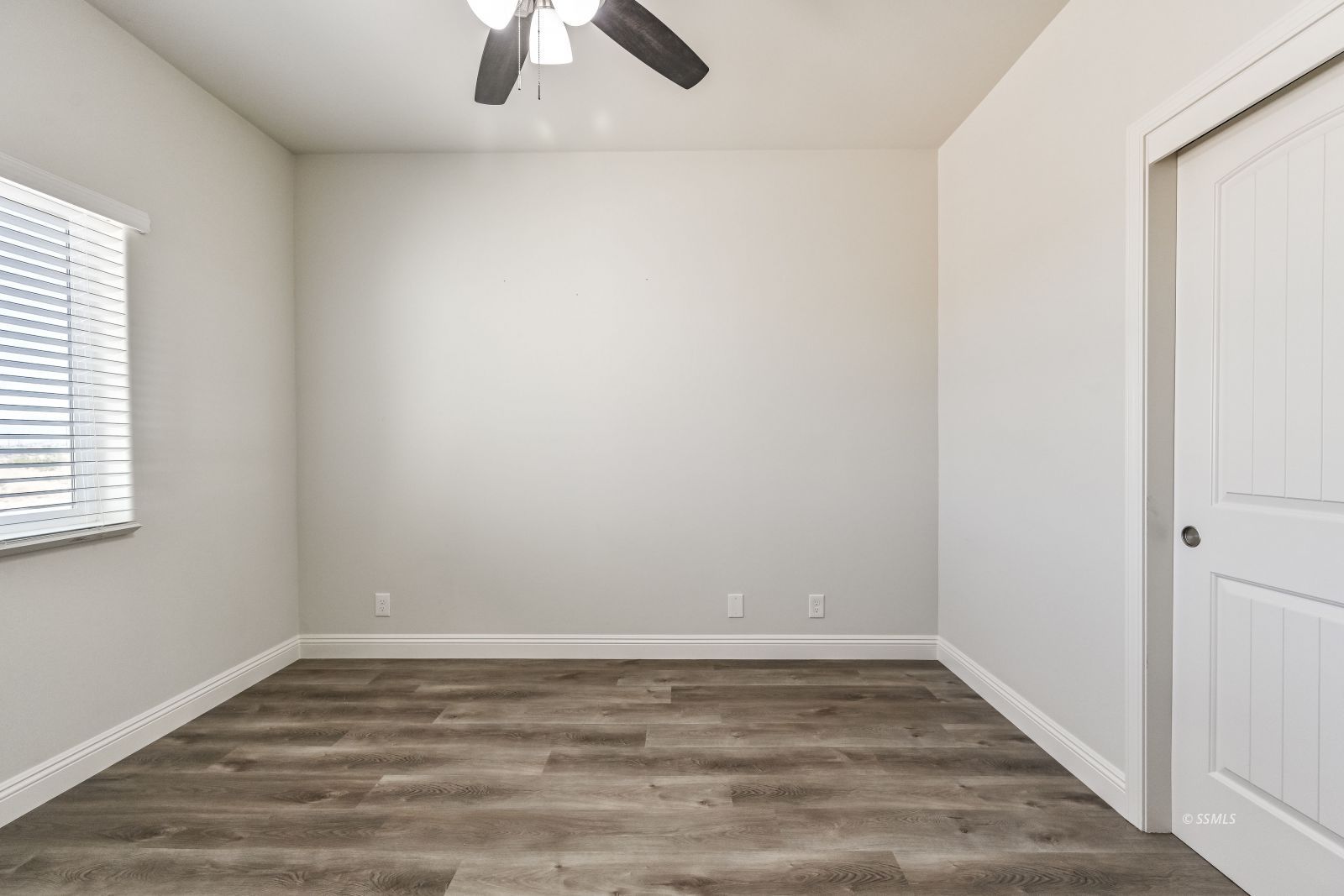 1031 West Church Avenue Ridgecrest, CA 93555 - Photo 38 of 49 a view of a room with wooden floor and window