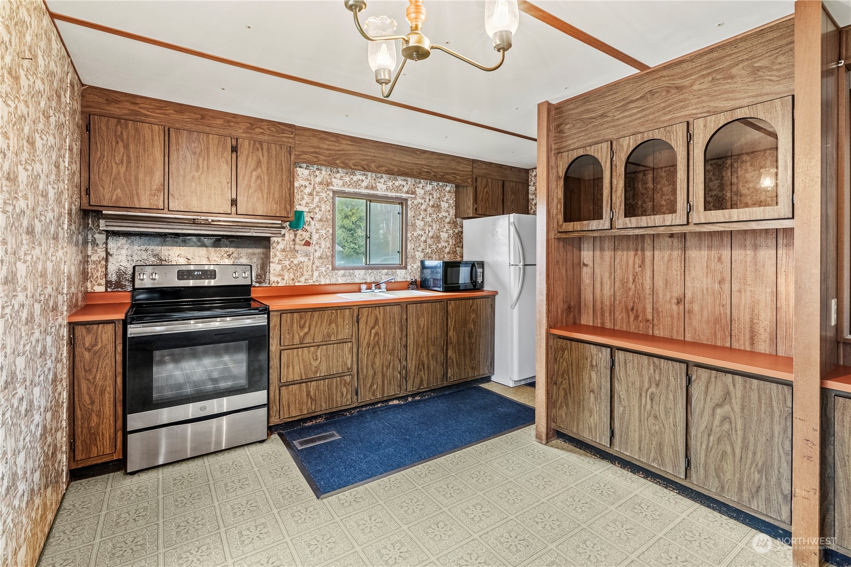 103 Diebert Road Longview, WA 98632 - Photo 6 of 18 a kitchen with stainless steel appliances granite countertop a stove a refrigerator and a sink with wooden cabinets