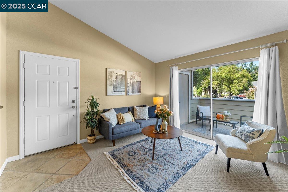 120 Reflections Drive, Unit 23 San Ramon, CA 94583 - Photo 1 of 1 a living room with furniture and a rug