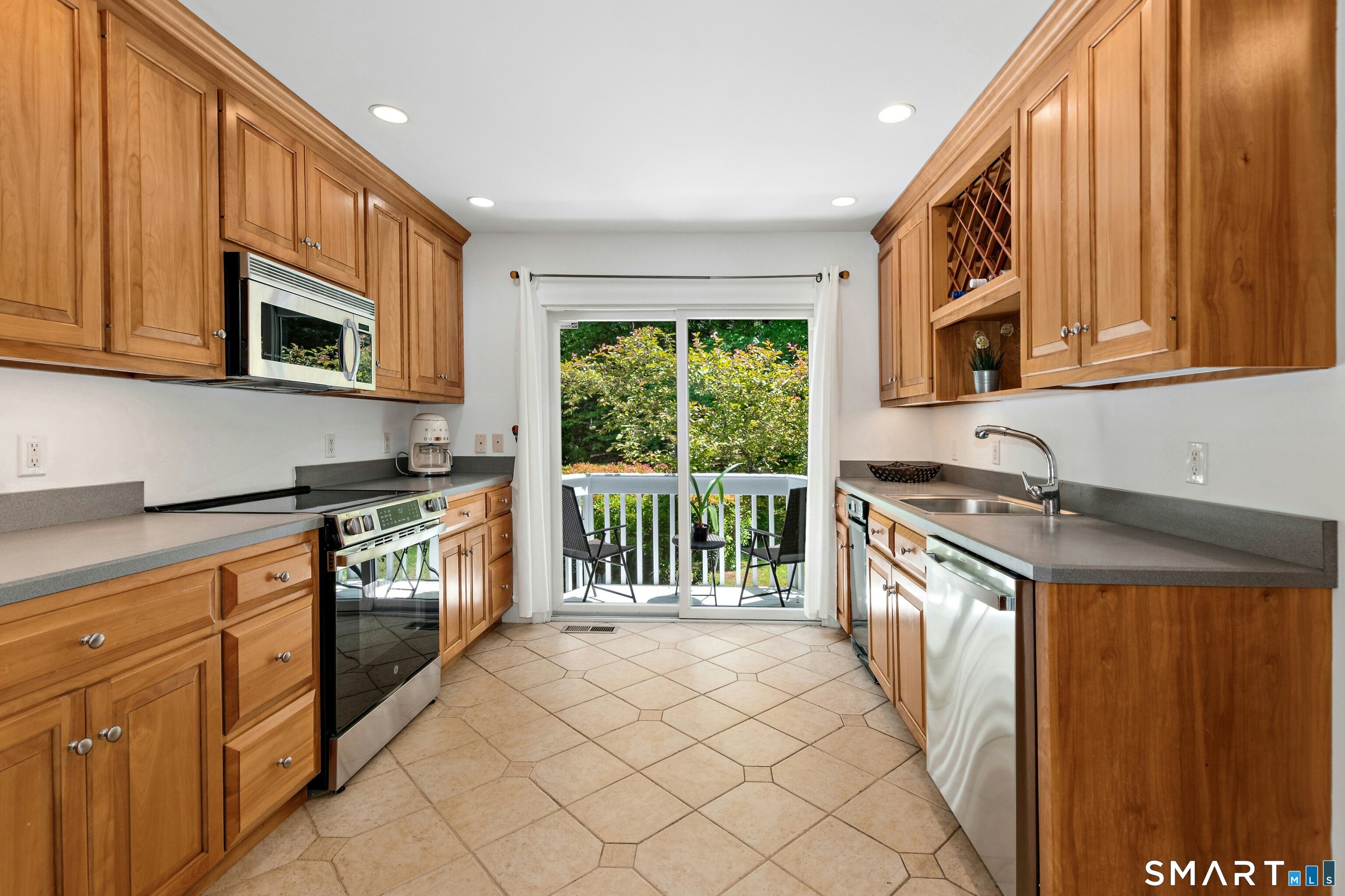 38 Old Redding Road Weston, CT 06883 - Photo 12 of 40 The Kitchen also accesses its private deck-a lovely spot to eat alfresco.