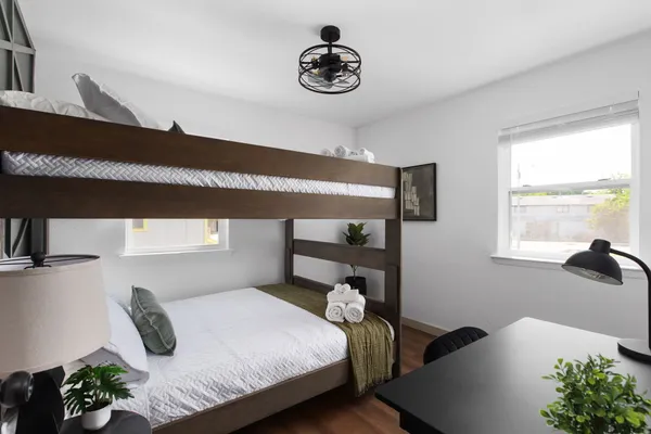 a bedroom with a bed and window