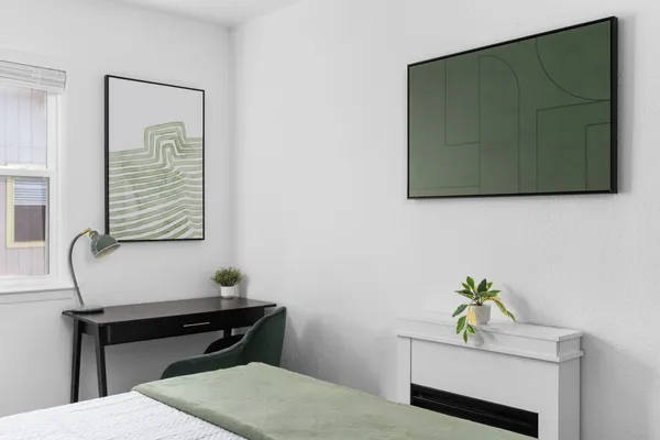 a living room with a table and a chair