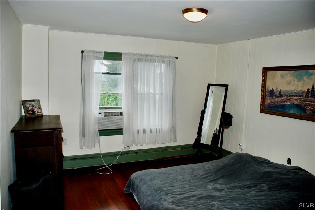 30 North 5th Street Emmaus, PA 18049 - Photo 13 of 20 a bedroom with a bed and a black dresser
