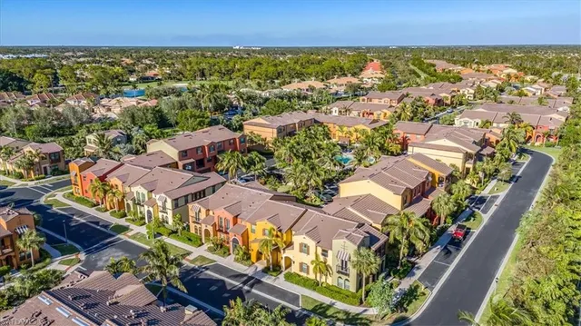 an aerial view of residential houses with outdoor space