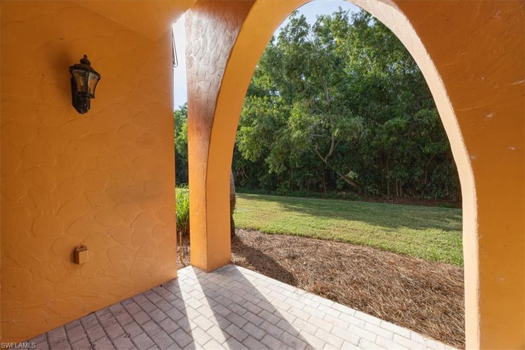 9111 Chula Vista Street, Unit 11604 Naples, FL 34113 - Photo 8 of 33 a view of a yard