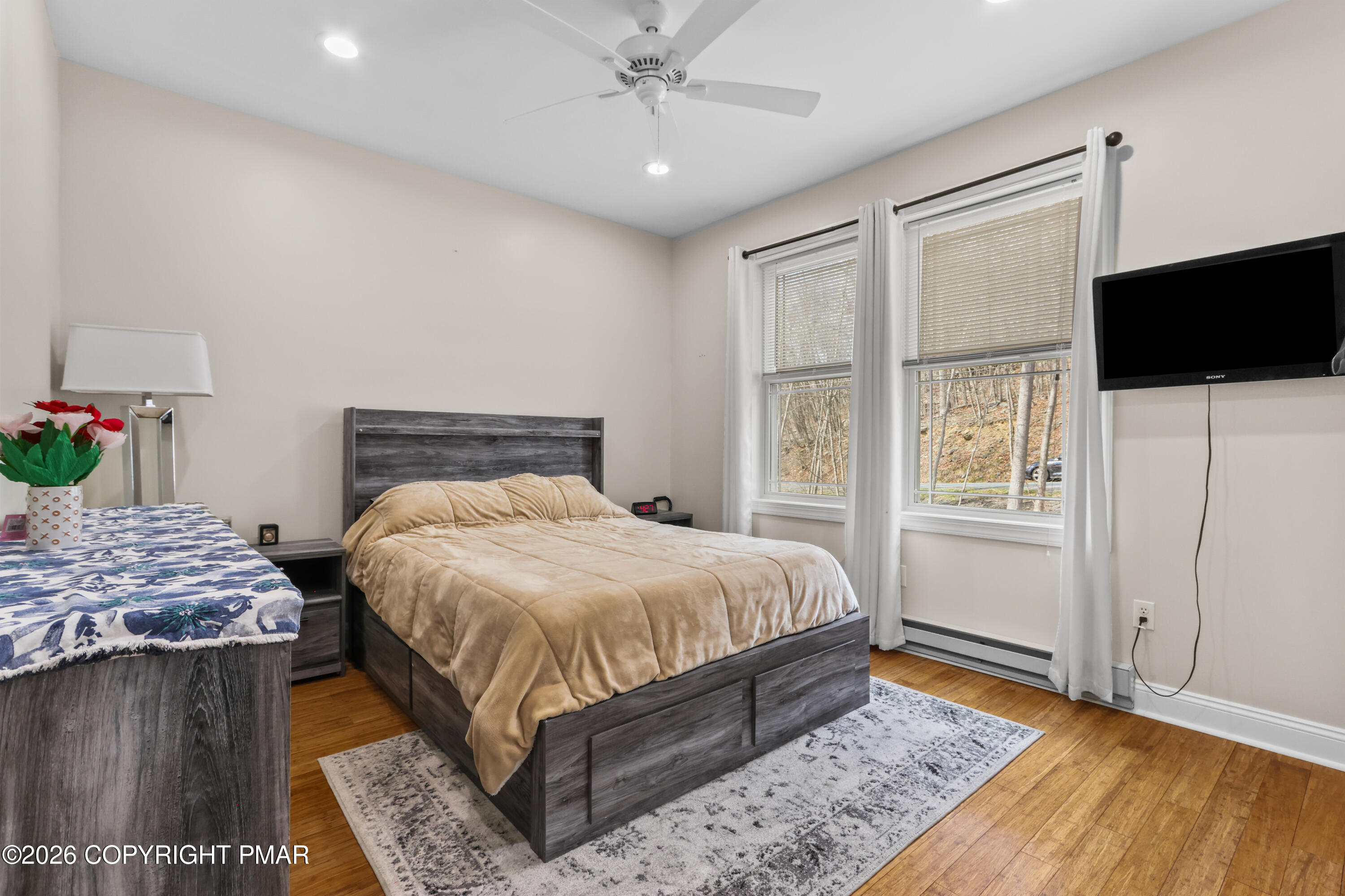 1007 Hampstead Road Bushkill, PA 18324 - Photo 21 of 68 a bedroom with a bed and a flat screen tv