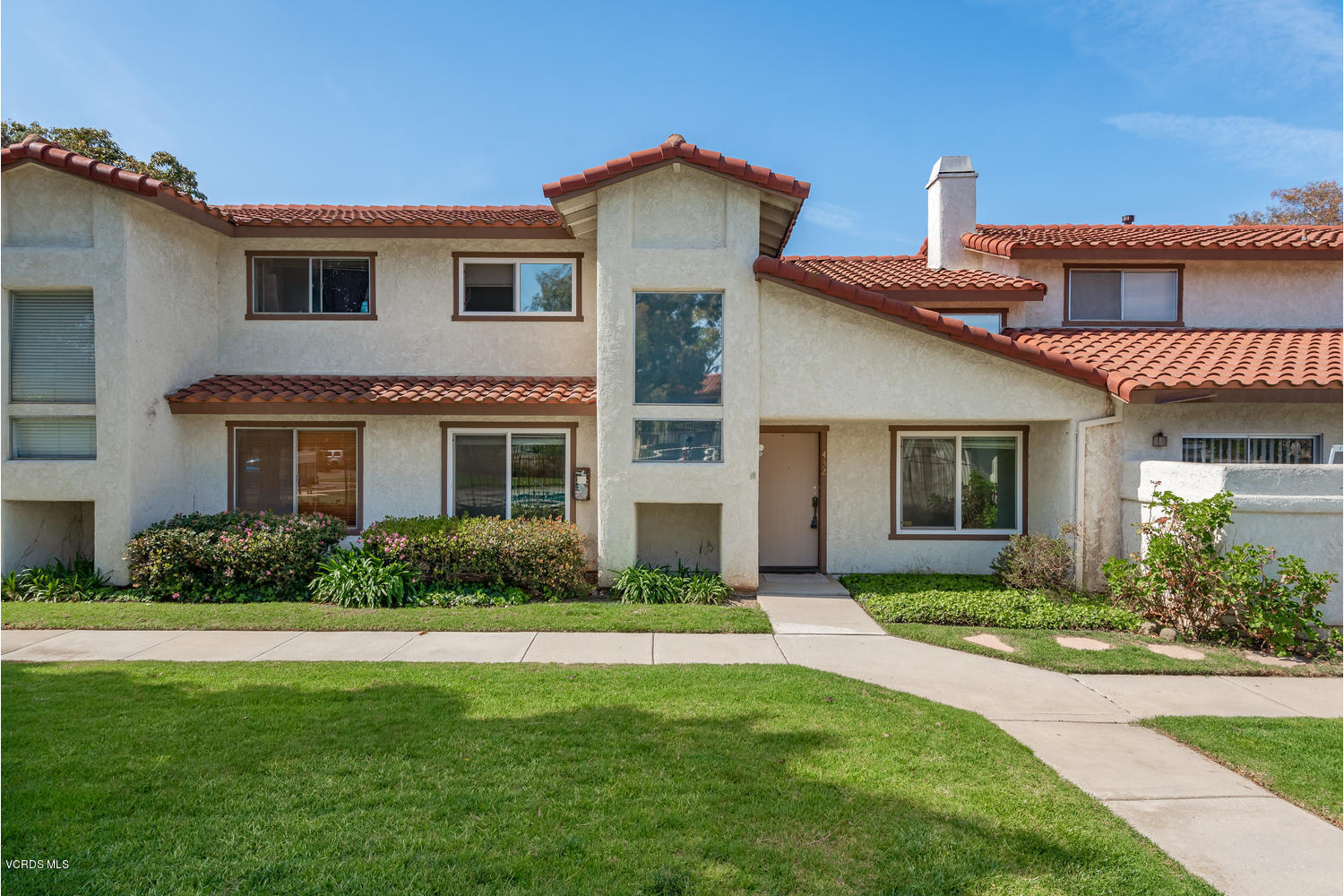 432 East Bard Road Oxnard, CA 93033 - Photo 2 of 20 a front view of a house with a yard and garage