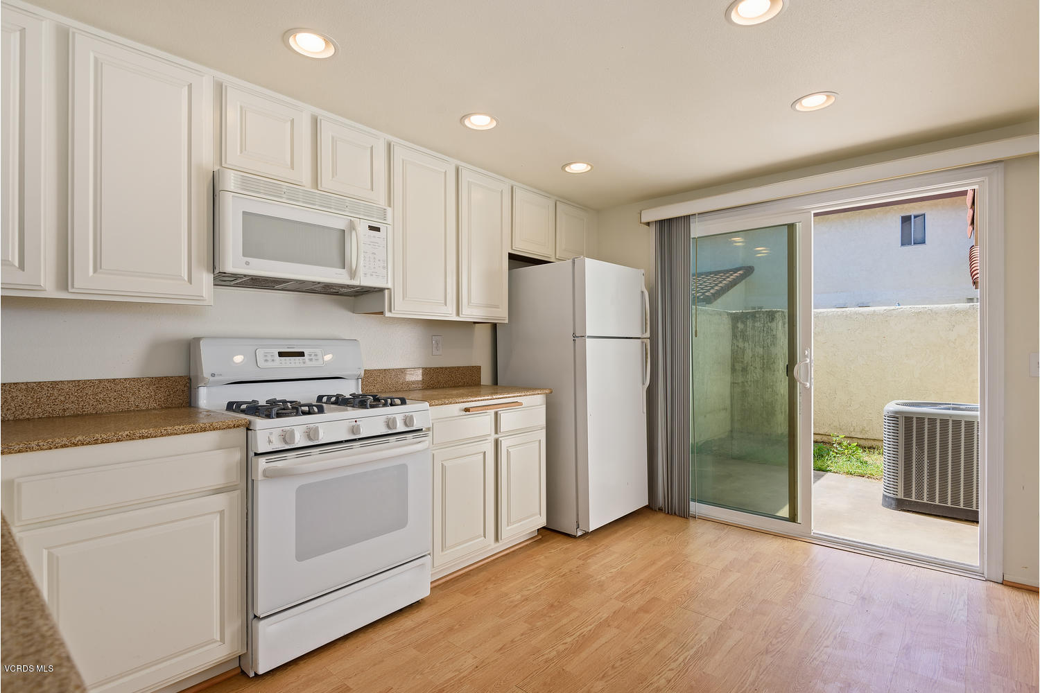 432 East Bard Road Oxnard, CA 93033 - Photo 11 of 20 a kitchen with cabinets and a stove