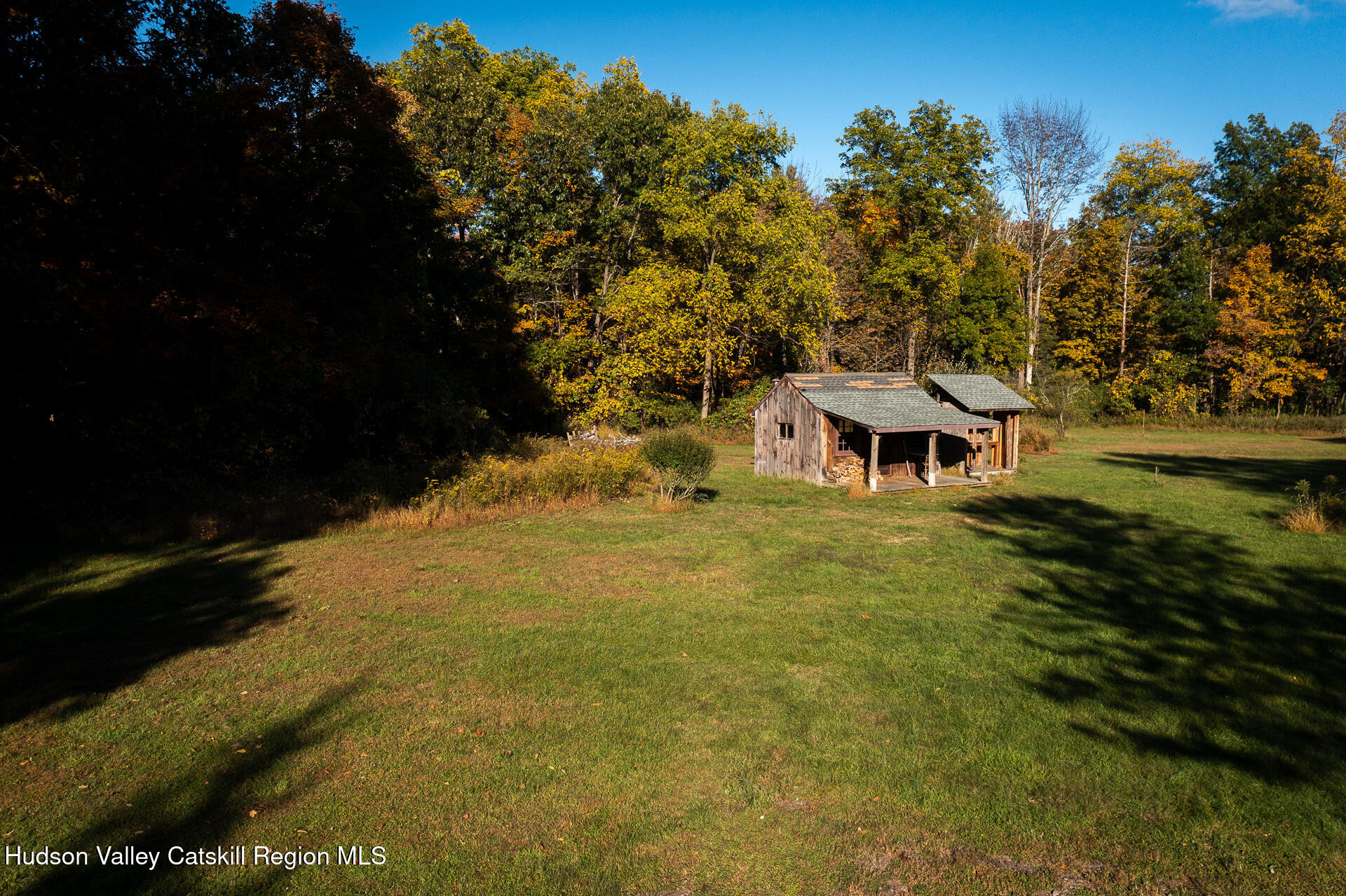 464 Mill Hook Road Accord, NY 12404 - Photo 14 of 14 a view of a swimming pool with a table and chairs under an umbrella