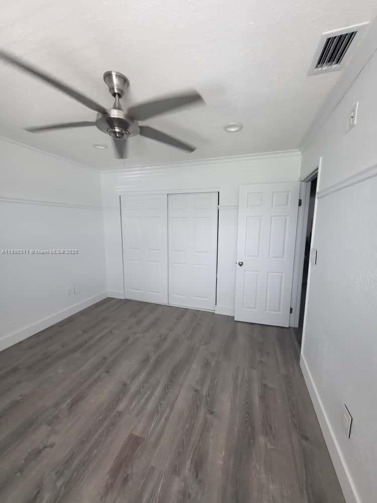 1236 North Hiatus Road, Unit 1236 Pembroke Pines, FL 33026 - Photo 14 of 19 wooden floor in an empty room