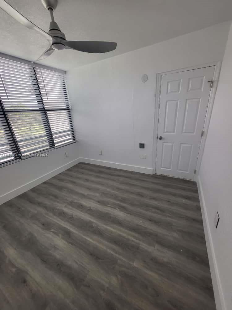 1236 North Hiatus Road, Unit 1236 Pembroke Pines, FL 33026 - Photo 6 of 19 wooden floor in an empty room