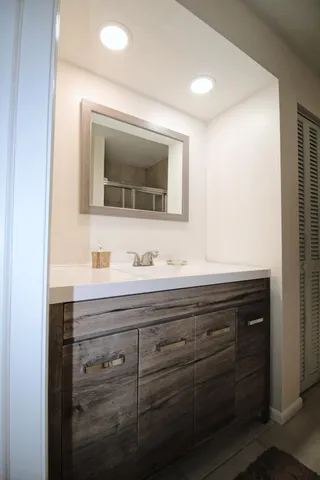 a bathroom with a sink and a mirror