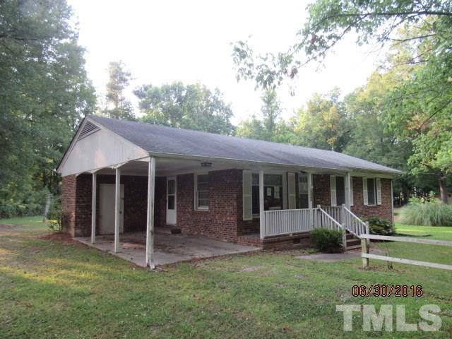 3444 Wiggins Road Spring Hope, NC 27882 - Photo 2 of 14 a view of a house with a yard and plants