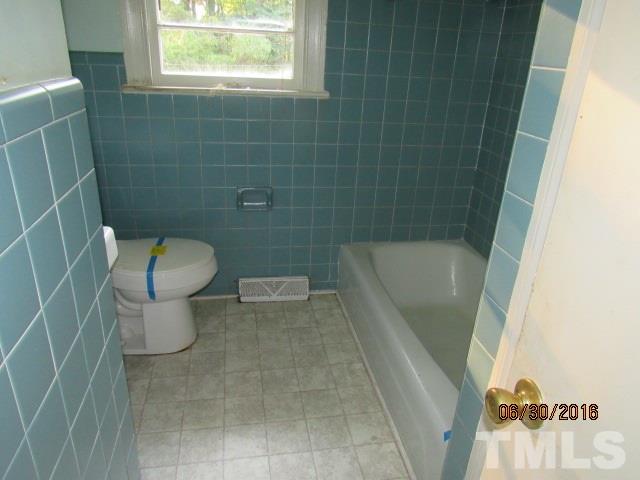 3444 Wiggins Road Spring Hope, NC 27882 - Photo 11 of 14 a bathroom with a toilet and a shower