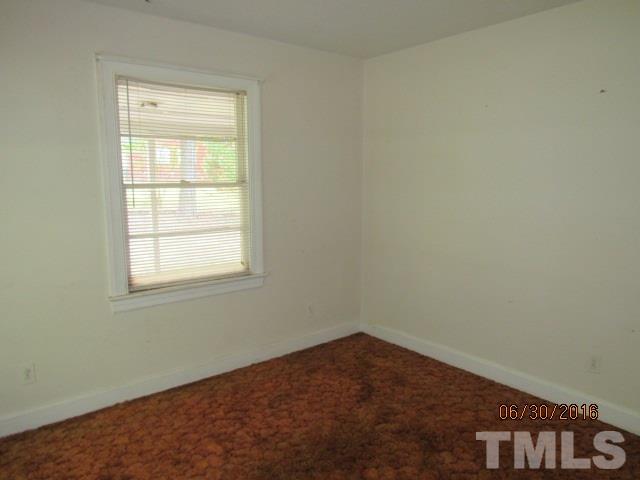 3444 Wiggins Road Spring Hope, NC 27882 - Photo 13 of 14 an empty room with a window