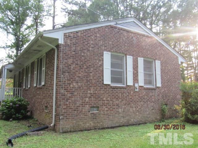 3444 Wiggins Road Spring Hope, NC 27882 - Photo 4 of 14 a front view of a house with garden