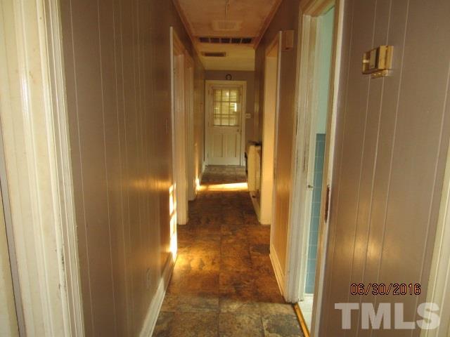 3444 Wiggins Road Spring Hope, NC 27882 - Photo 10 of 14 a view of a hallway with wooden floor