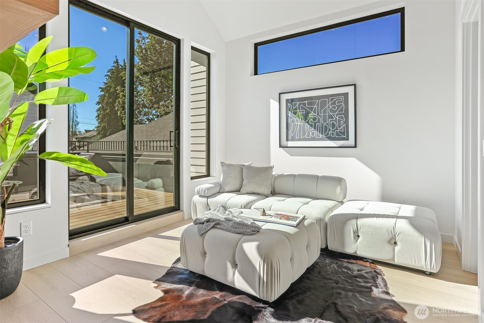 8750 13th Avenue Northwest, Unit B Seattle, WA 98117 - Photo 13 of 28 a bedroom with a bed and a painting on the wall