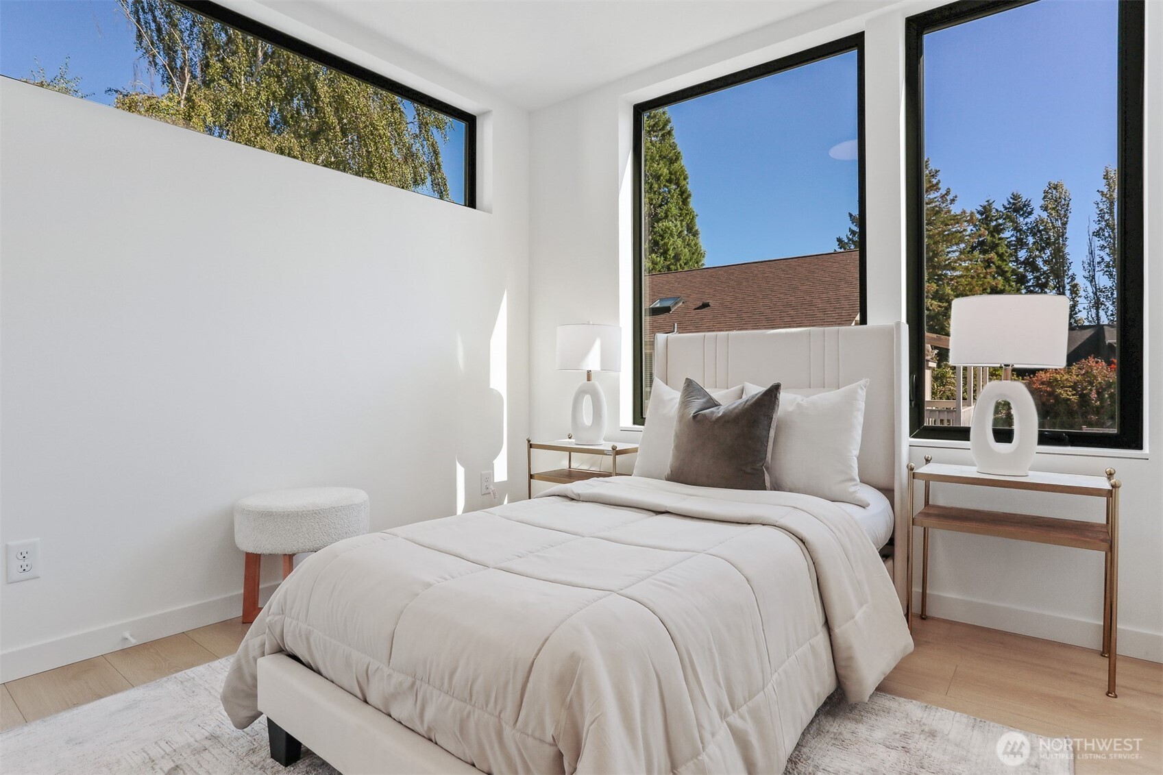 8750 13th Avenue Northwest, Unit B Seattle, WA 98117 - Photo 22 of 28 a bedroom with a bed and a window