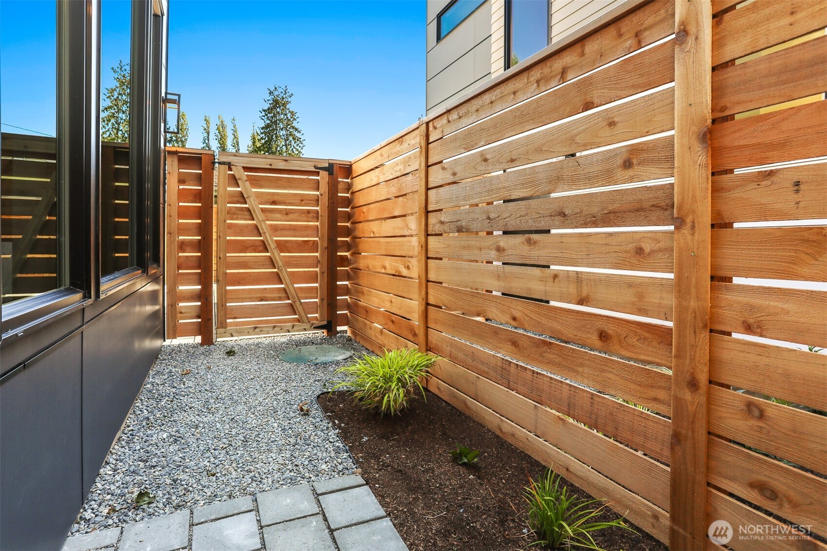 8750 13th Avenue Northwest, Unit B Seattle, WA 98117 - Photo 26 of 28 a view of a house with a door and wooden floor
