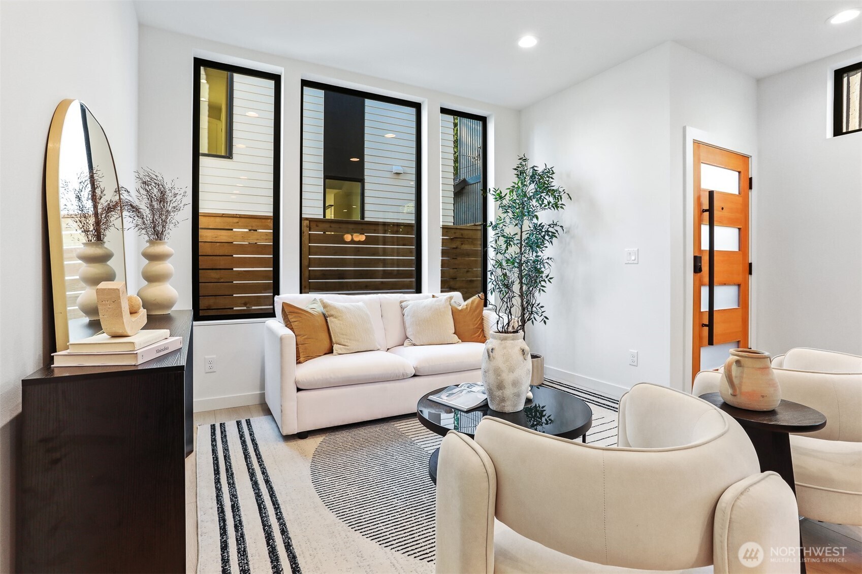 8750 13th Avenue Northwest, Unit B Seattle, WA 98117 - Photo 6 of 28 a living room with furniture and a large window