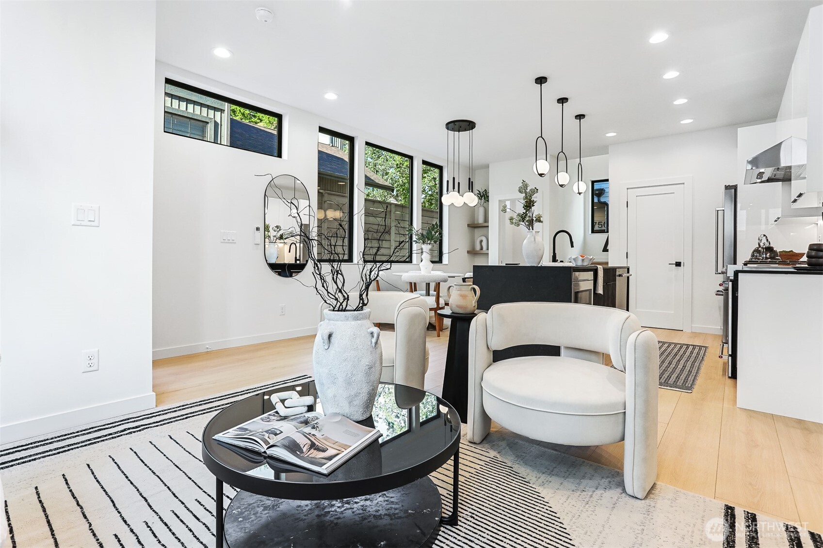 8750 13th Avenue Northwest, Unit B Seattle, WA 98117 - Photo 7 of 28 a living room with furniture and a table