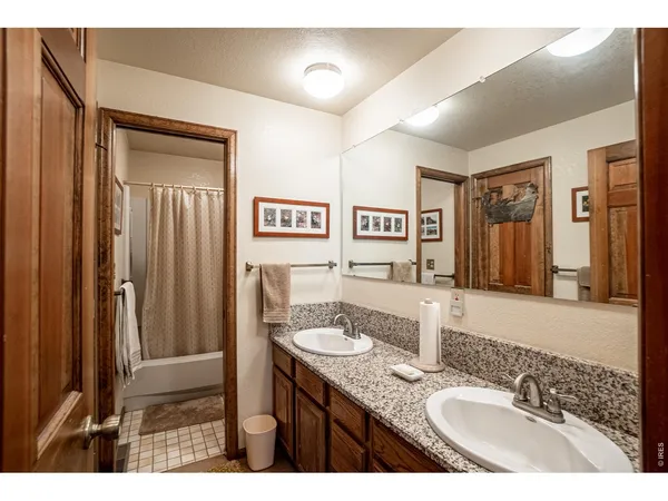 a bathroom with a granite countertop sink mirror and a
