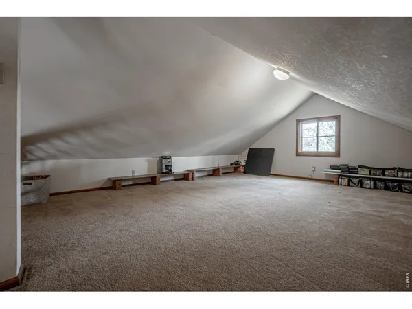 a view of a big room with windows and fireplace