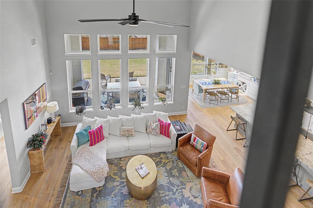 13753 Green Elm Road Fort Worth, TX 76008 - Photo 2 of 40 Main living room view from the staircase landing! Great views of the outdoors and open to kitchen and casual dining.