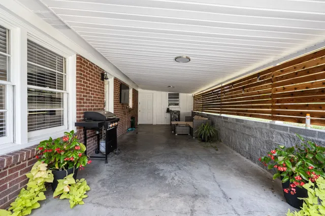 a outdoor space with patio furniture and a potted plant