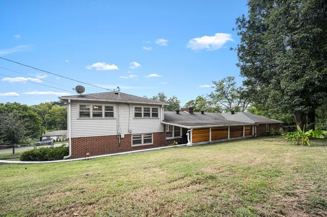 a view of a city with lush green forest